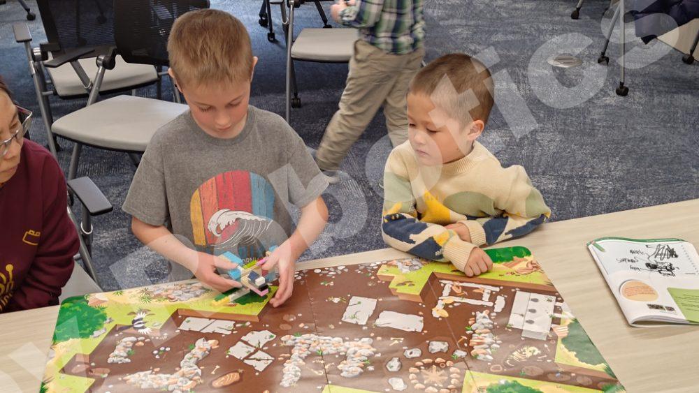 Kids participating in a hands-on STEM activity during the 2025 Fall Program.